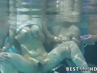 Suzuna Komiya&comma; the nastiest Asian woman&comma; gives fellatio by the pool in the greatest Japanese group fuck-a-thon scene&period;